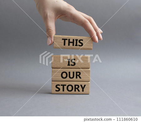 This is our Story symbol. Wooden blocks with words This is our Story. Businessman hand. Beautiful grey background. Business and This is our Story concept. Copy space. This is our Story symbol. Wooden blocks with words This is our Story. Businessman hand. Beautiful grey background. Business and This is our Story concept. Copy space. 111860610