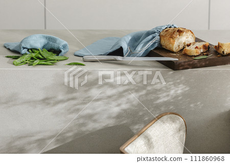 Sliced bread on wooden board, green beans linen bag and stainless still kitchen knife. Kitchen aesthetic concept Sliced bread on wooden board, green beans linen bag and stainless still kitchen knife. Kitchen aesthetic concept 111860968