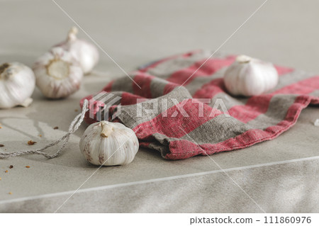 organic garlic in linen bag. Kitchen aesthetic concept 111860976