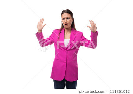young charismatic successful brunette business lady is dressed in a bright crimson jacket on a white young charismatic successful brunette business lady is dressed in a bright crimson jacket on a white 111861012