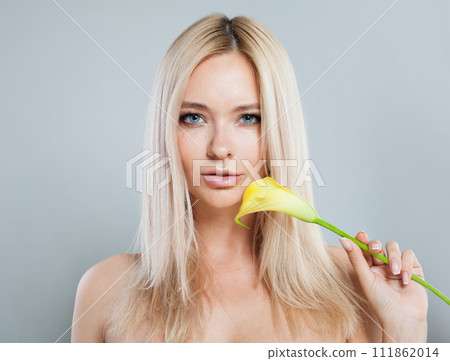 Charming young good-looking female model with long colored hair and healthy skin portrait.  111862014