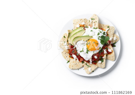 Traditional Mexican breakfast red chilaquiles with egg isolated on white background 111862169