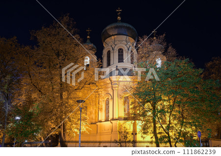 1869 Metropolitan Cathedral of Saint Mary Magdalene Orthodox church facade with Christian crosses on top of the domes illuminated at night in the Praga borough Warsaw, Poland. 1869 Metropolitan Cathedral of Saint Mary Magdalene Orthodox church facade with Christian crosses on top of the domes illuminated at night in the Praga borough Warsaw, Poland. 111862239