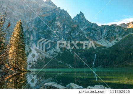 Tatra National Park in Poland. Famous mountains lake Morskie oko or sea eye lake In High Tatras. Five lakes valley Tatra National Park in Poland. Famous mountains lake Morskie oko or sea eye lake In High Tatras. Five lakes valley 111862906