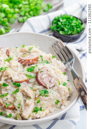 Chicken bog dish with smocked sausages, traditional South Carolina recipe, in bowl, vertical Chicken bog dish with smocked sausages, traditional South Carolina recipe, in bowl, vertical 111862980