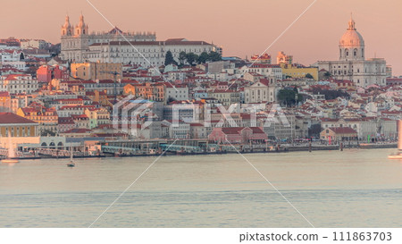 Panorama of Lisbon historical center and ferry terminal Terreiro do Paco aerial timelapse during sunset from above. Portugal 111863703
