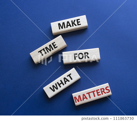 Important thing symbol. Wooden blocks with words Make time for what matters. Businessman hand. Beautiful deep blue background. Business and important thing concept. Copy space. Important thing symbol. Wooden blocks with words Make time for what matters. Businessman hand. Beautiful deep blue background. Business and important thing concept. Copy space. 111863730