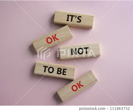 Mental Health symbol. Wooden blocks with words It is ok not to be ok. Beautiful pink background. Mental Health concept. Copy space. Mental Health symbol. Wooden blocks with words It is ok not to be ok. Beautiful pink background. Mental Health concept. Copy space. 111863732