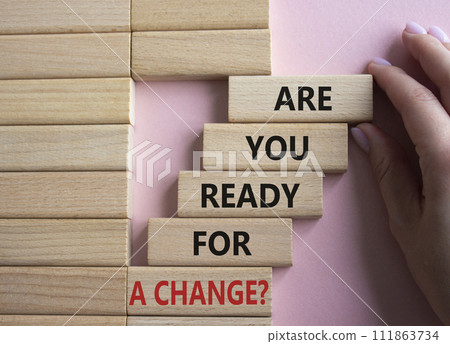 Change symbol. Wooden blocks with words Are you ready for a new change. Businessman hand. Beautiful pink background. Business and change concept. Copy space. 111863734