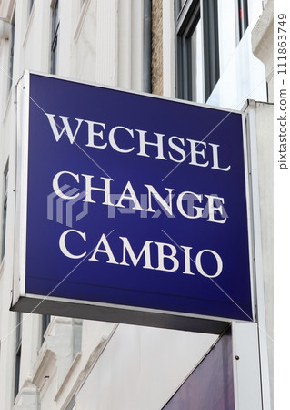 Exchange, wechsel, change, cambio sign on a wall Exchange, wechsel, change, cambio sign on a wall 111863749