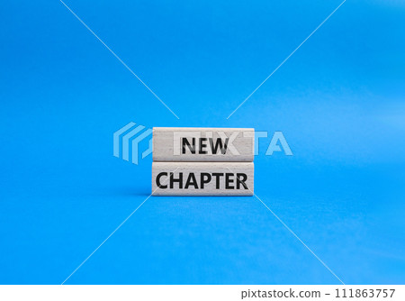New Chapter symbol. Concept word New Chapter on wooden blocks. Beautiful blue background. Business and New Chapter concept. Copy space 111863757