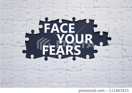Face your Fears symbol. Concept words Face your Fears on white puzzle. Beautiful deep blue background. Business and Face your Fears. Copy space. Face your Fears symbol. Concept words Face your Fears on white puzzle. Beautiful deep blue background. Business and Face your Fears. Copy space. 111863835