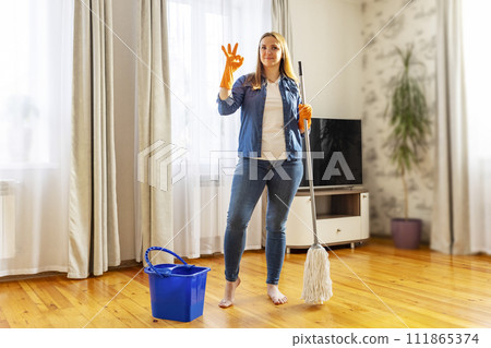 Young Woman Ready for Spring Cleaning at Home Young Woman Ready for Spring Cleaning at Home 111865374
