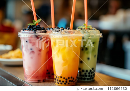 AI-generated content. Three colorful bubble tea drinks in a row, featuring pink, yellow, and green hues with tapioca, garnished with fruit toppings, and ready-to-drink with straws 111866380