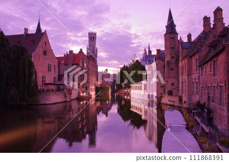 Evening view of the cityscape reflected in the canals of the historic center of Bruges (Brugge), a world cultural heritage site in Belgium, Western Europe Evening view of the cityscape reflected in the canals of the historic center of Bruges (Brugge), a world cultural heritage site in Belgium, Western Europe 111868391