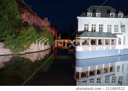 Night view of the cityscape reflected in the canals of the historic center of Bruges (Brugge), a world cultural heritage site in Belgium, Western Europe Night view of the cityscape reflected in the canals of the historic center of Bruges (Brugge), a world cultural heritage site in Belgium, Western Europe 111869522