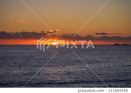 A fantastic scene of the Daruma sunrise rising over the Pacific Ocean A fantastic scene of the Daruma sunrise rising over the Pacific Ocean 111869598