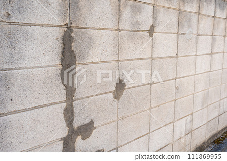 old concrete block wall old concrete block wall 111869955