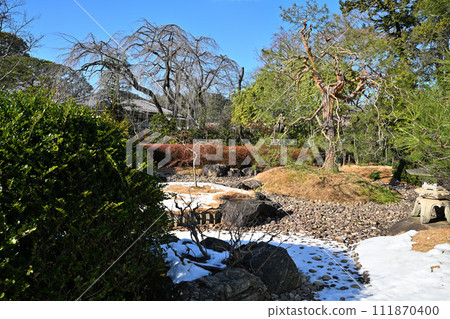 Nakain garden with remaining snow winter scenery Nakain garden with remaining snow winter scenery 111870400