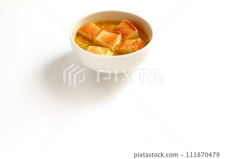 A bowl of grained corn soup and sliced toast A bowl of grained corn soup and sliced toast 111870479