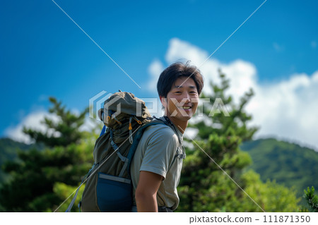 A young man enjoying the summer mountains 111871350