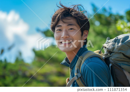 A young man enjoying the summer mountains 111871354