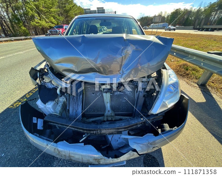 wrecked auto on the side of a road wrecked auto on the side of a road 111871358