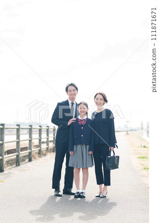 Portrait of a family walking along the bank 111871671
