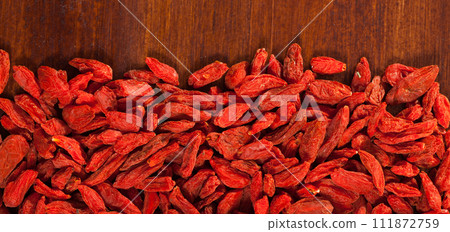 Goji berries on wooden surface 111872759