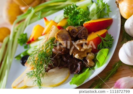 Salad of chicken hearts with peach, pear, fried cheese Salad of chicken hearts with peach, pear, fried cheese 111872799