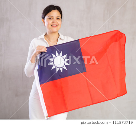 Young woman posing in studio with Taiwan flag 111873719