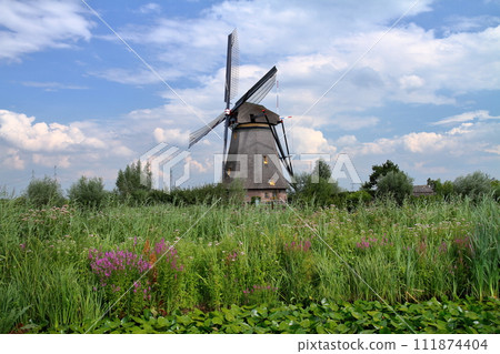 A group of windmills in Kinderdijk, a World Heritage Site, near Rotterdam, South Holland, in the Netherlands in Western Europe. A group of windmills in Kinderdijk, a World Heritage Site, near Rotterdam, South Holland, in the Netherlands in Western Europe. 111874404