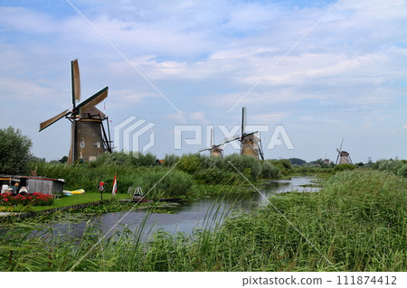 A group of windmills in Kinderdijk, a World Heritage Site, near Rotterdam, South Holland, in the Netherlands in Western Europe. 111874412