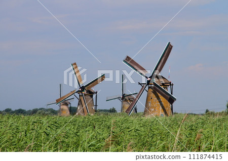 A group of windmills in Kinderdijk, a World Heritage Site, near Rotterdam, South Holland, in the Netherlands in Western Europe. A group of windmills in Kinderdijk, a World Heritage Site, near Rotterdam, South Holland, in the Netherlands in Western Europe. 111874415