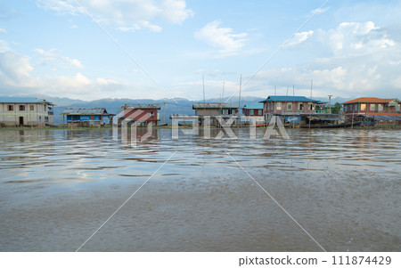 Inle Lake City, The Floating village urban city town houses, lake sea or river. Nature landscape fisheries and fishing tools, Myanmar. Aquaculture farming Inle Lake City, The Floating village urban city town houses, lake sea or river. Nature landscape fisheries and fishing tools, Myanmar. Aquaculture farming 111874429