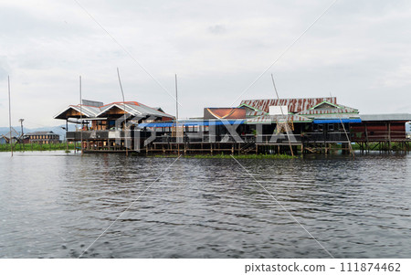 Inle Lake City, The Floating village urban city town houses, lake sea or river. Nature landscape fisheries and fishing tools, Myanmar. Aquaculture farming 111874462
