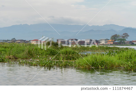 Inle Lake City, The Floating village urban city town houses, lake sea or river. Nature landscape fisheries and fishing tools, Myanmar. Aquaculture farming Inle Lake City, The Floating village urban city town houses, lake sea or river. Nature landscape fisheries and fishing tools, Myanmar. Aquaculture farming 111874467