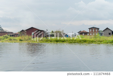 Inle Lake City, The Floating village urban city town houses, lake sea or river. Nature landscape fisheries and fishing tools, Myanmar. Aquaculture farming Inle Lake City, The Floating village urban city town houses, lake sea or river. Nature landscape fisheries and fishing tools, Myanmar. Aquaculture farming 111874468