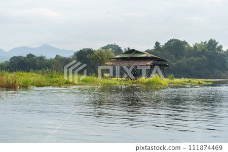 Inle Lake City, The Floating village urban city town houses, lake sea or river. Nature landscape fisheries and fishing tools, Myanmar. Aquaculture farming Inle Lake City, The Floating village urban city town houses, lake sea or river. Nature landscape fisheries and fishing tools, Myanmar. Aquaculture farming 111874469
