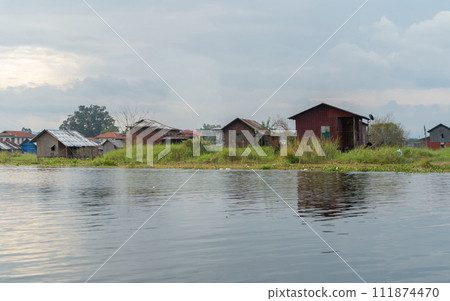 Inle Lake City, The Floating village urban city town houses, lake sea or river. Nature landscape fisheries and fishing tools, Myanmar. Aquaculture farming Inle Lake City, The Floating village urban city town houses, lake sea or river. Nature landscape fisheries and fishing tools, Myanmar. Aquaculture farming 111874470
