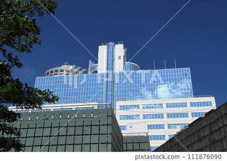 Blue sky and clouds reflected in the window of a building in Rotterdam, the central city of South Holland in the Netherlands in Western Europe Blue sky and clouds reflected in the window of a building in Rotterdam, the central city of South Holland in the Netherlands in Western Europe 111876090