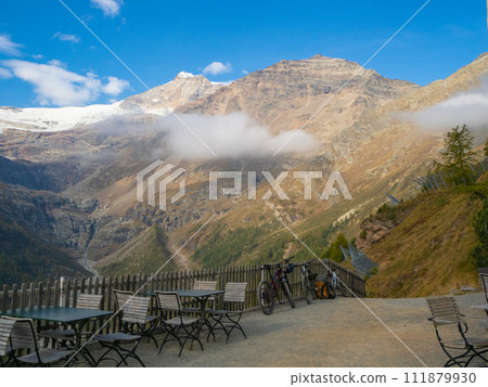 Alp Gruem, Switzerland - October 14th 2023: Amazing view from the restaurant terrace towards famous Piz Palue Alp Gruem, Switzerland - October 14th 2023: Amazing view from the restaurant terrace towards famous Piz Palue 111879930