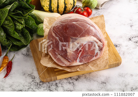 Uncooked raw pork knuckle with spices Uncooked raw pork knuckle with spices 111882007