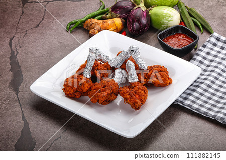 Indian cuisine glazed chicken lollipop Indian cuisine glazed chicken lollipop 111882145