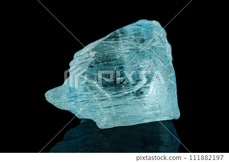 Macro tourmaline mineral stone on black background Macro tourmaline mineral stone on black background 111882197