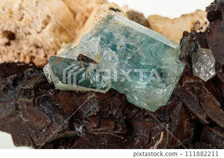 Macro tourmaline mineral stone on white background Macro tourmaline mineral stone on white background 111882211