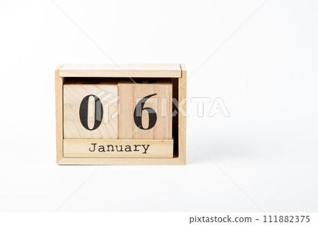 Wooden calendar January 06 on a white background Wooden calendar January 06 on a white background 111882375