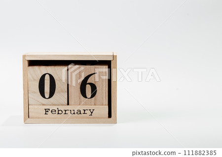 Wooden calendar February 06 on a white background Wooden calendar February 06 on a white background 111882385