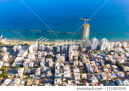 High-rise building construction site ay Limassol seafront. Cyprus High-rise building construction site ay Limassol seafront. Cyprus 111883049