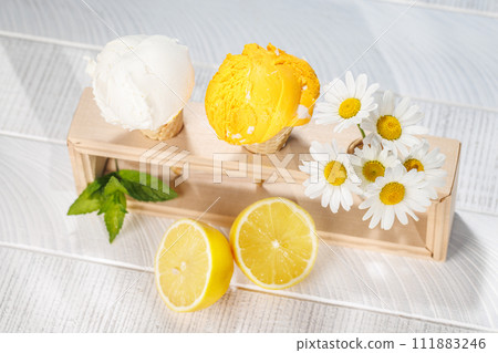 Refreshing ice cream in waffle cones with lemon flavour 111883246